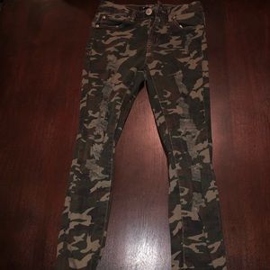 Distressed camo jeans